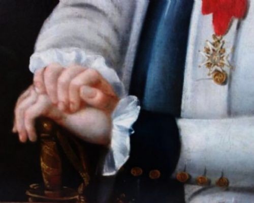 An 18th-century oil portrait of a French naval officer in uniform with gold epaulettes, set within an ornate carved gold gilt frame. View VI