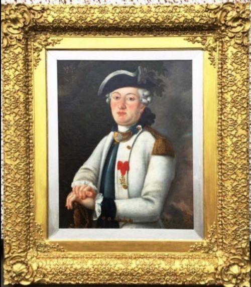 An 18th-century oil portrait of a French naval officer in uniform with gold epaulettes, set within an ornate carved gold gilt frame. View VII