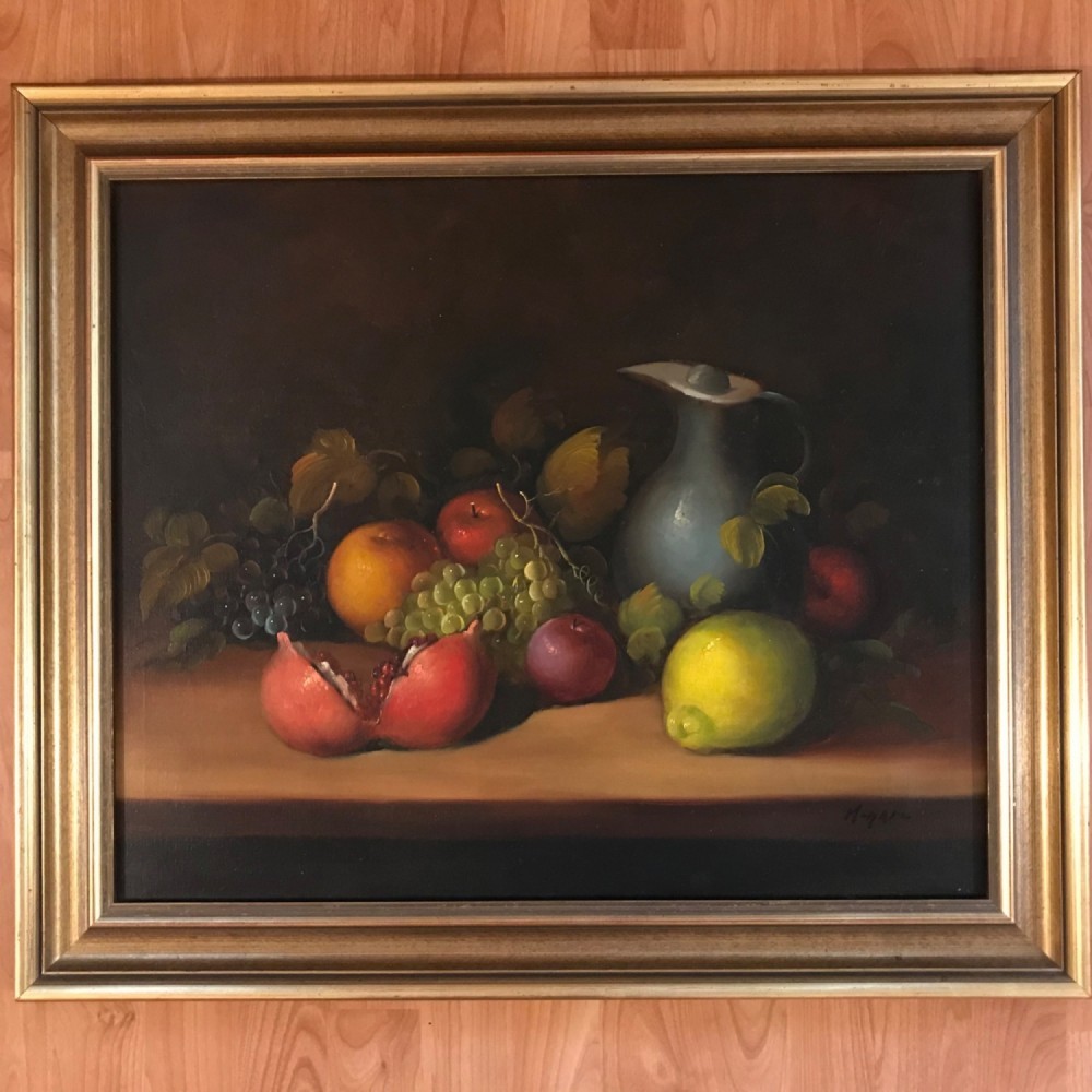 An oil painting on canvas depicting a fruit still life composition with pomegranates, grapes, apples, and a pewter jug set within a moulded gold frame. View IV