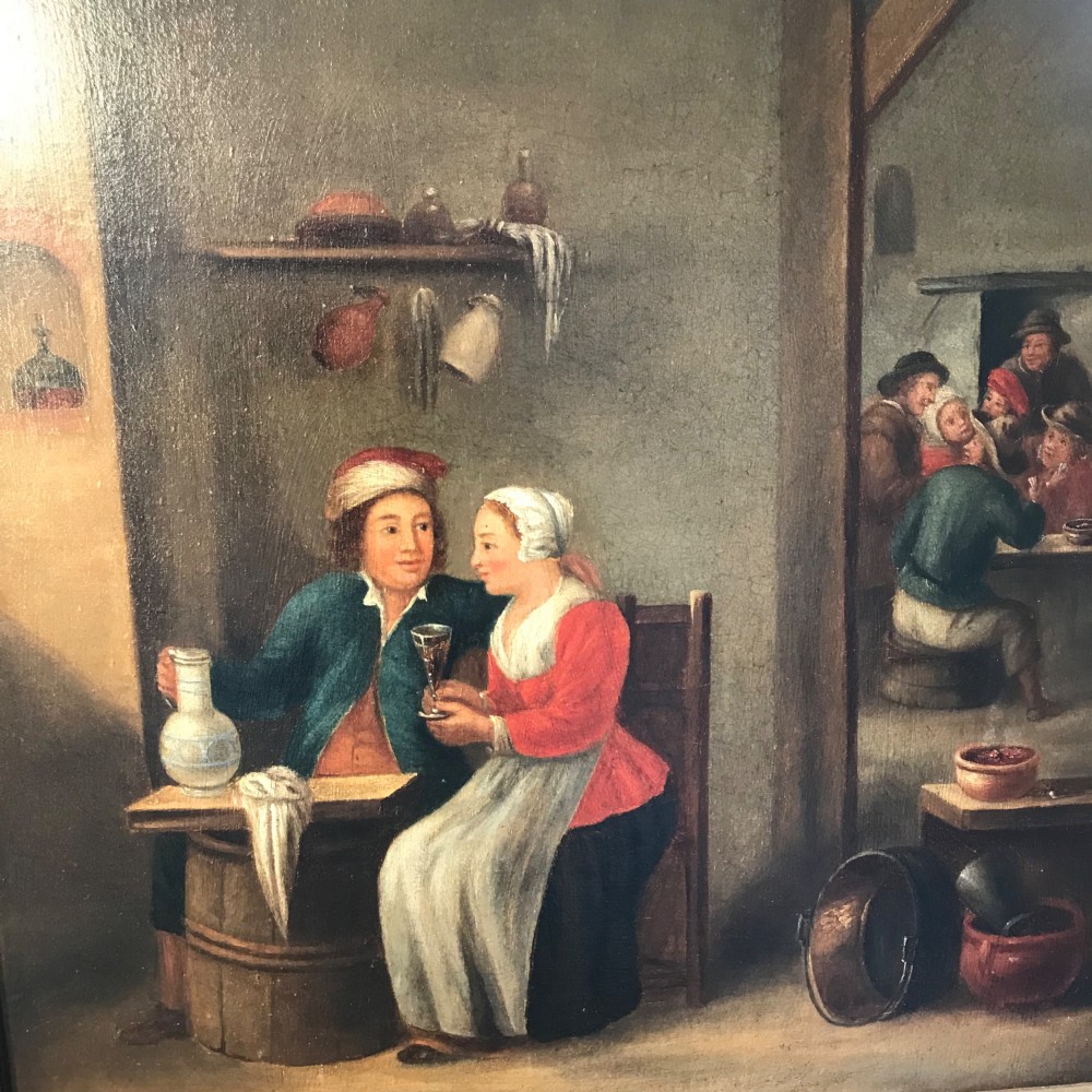 An eighteenth-century style Dutch school oil painting depicting a man and a woman seated inside a rustic tavern setting. View II