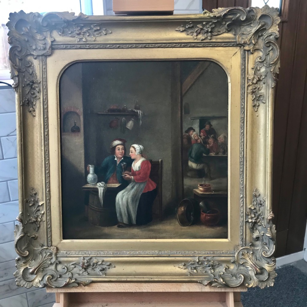 An eighteenth-century style Dutch school oil painting depicting a man and a woman seated inside a rustic tavern setting. View XIII