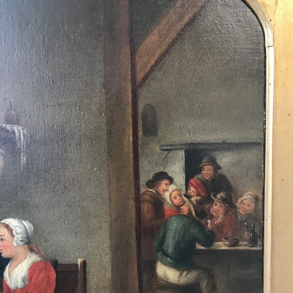 An 18th-century style oil painting depicting figures inside a tavern interior, set within a carved gold giltwood frame. View VII