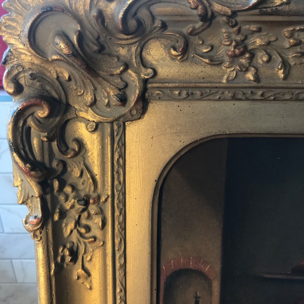 An 18th-century style oil painting depicting figures inside a tavern interior, set within a carved gold giltwood frame. View XIV