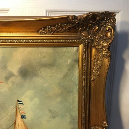 An antique oil painting depicting a three-masted wooden sailing vessel on choppy seas, set within an ornate gilt frame. View XII