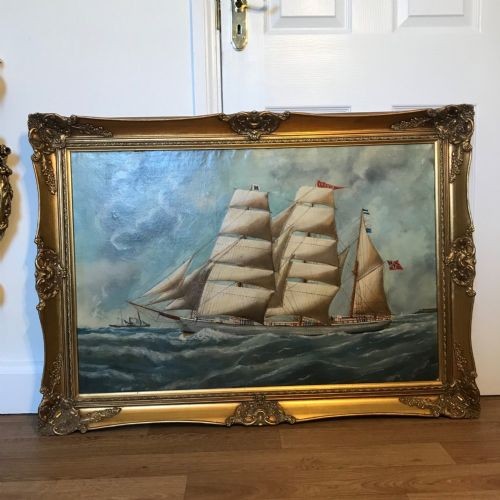 An antique oil painting depicting a three-masted wooden sailing vessel on choppy seas, set within an ornate gilt frame. View XIV