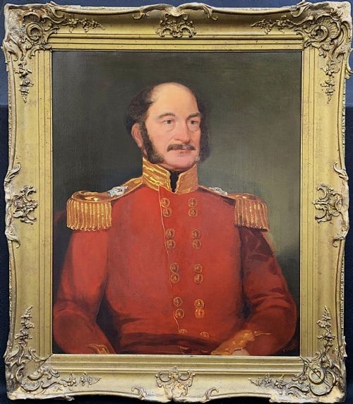 An oil portrait of a 19th-century British military officer wearing a red uniform coat with gold epaulettes, set within an ornate gilded frame.
