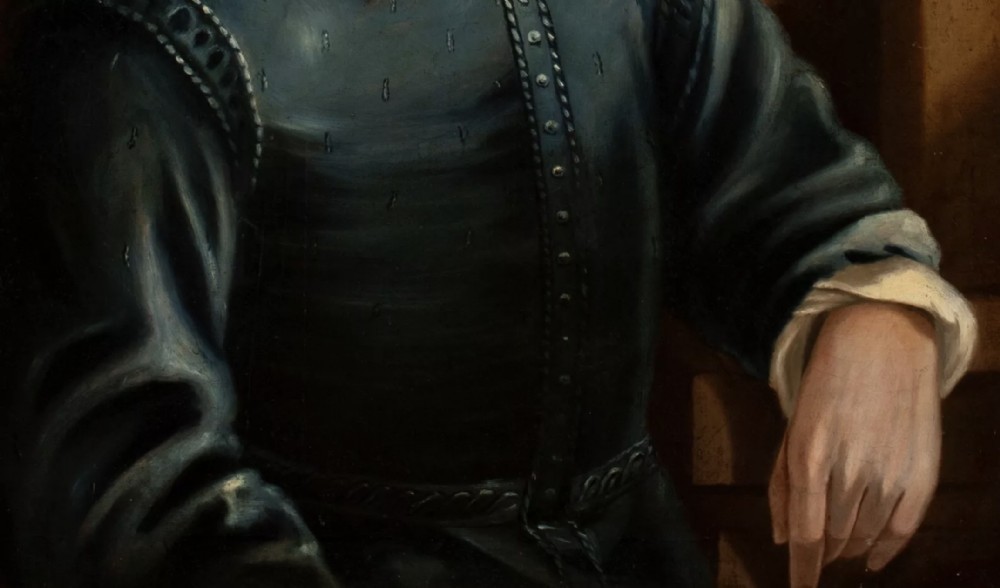 A 19th-century oil painting depicting William Shakespeare wearing a blue doublet with a white turn-down collar, presented in a gold-finished frame. View X