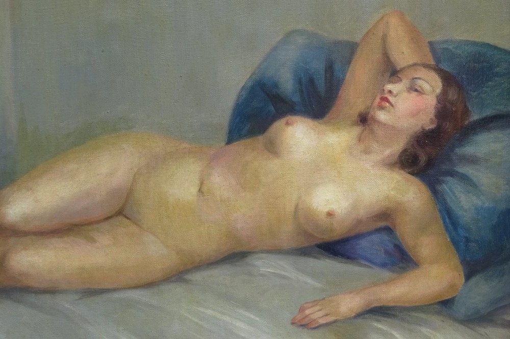A framed French Art Deco oil painting on canvas depicting a reclining female nude resting against a blue pillow. View IV