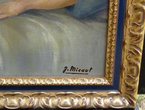 A framed French Art Deco oil painting on canvas depicting a reclining female nude resting against a blue pillow. View VI