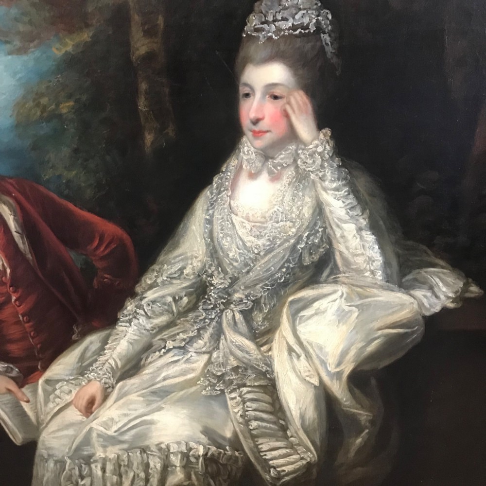 An eighteenth-century style double oil portrait featuring a seated couple in period costume framed in an ornate gilded frame. View VII