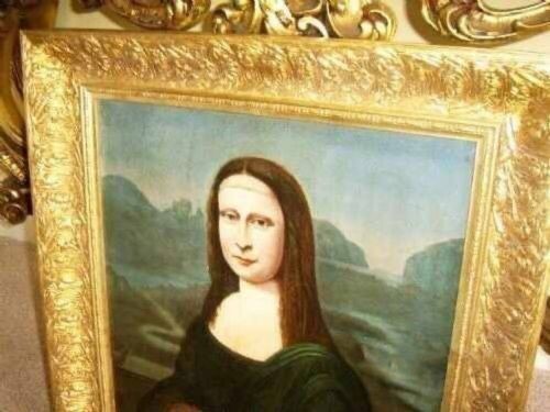 An 18th-century oil portrait painting after Leonardo da Vincis Mona Lisa depicted in a green dress and set within an ornate carved gold gilt frame. View III