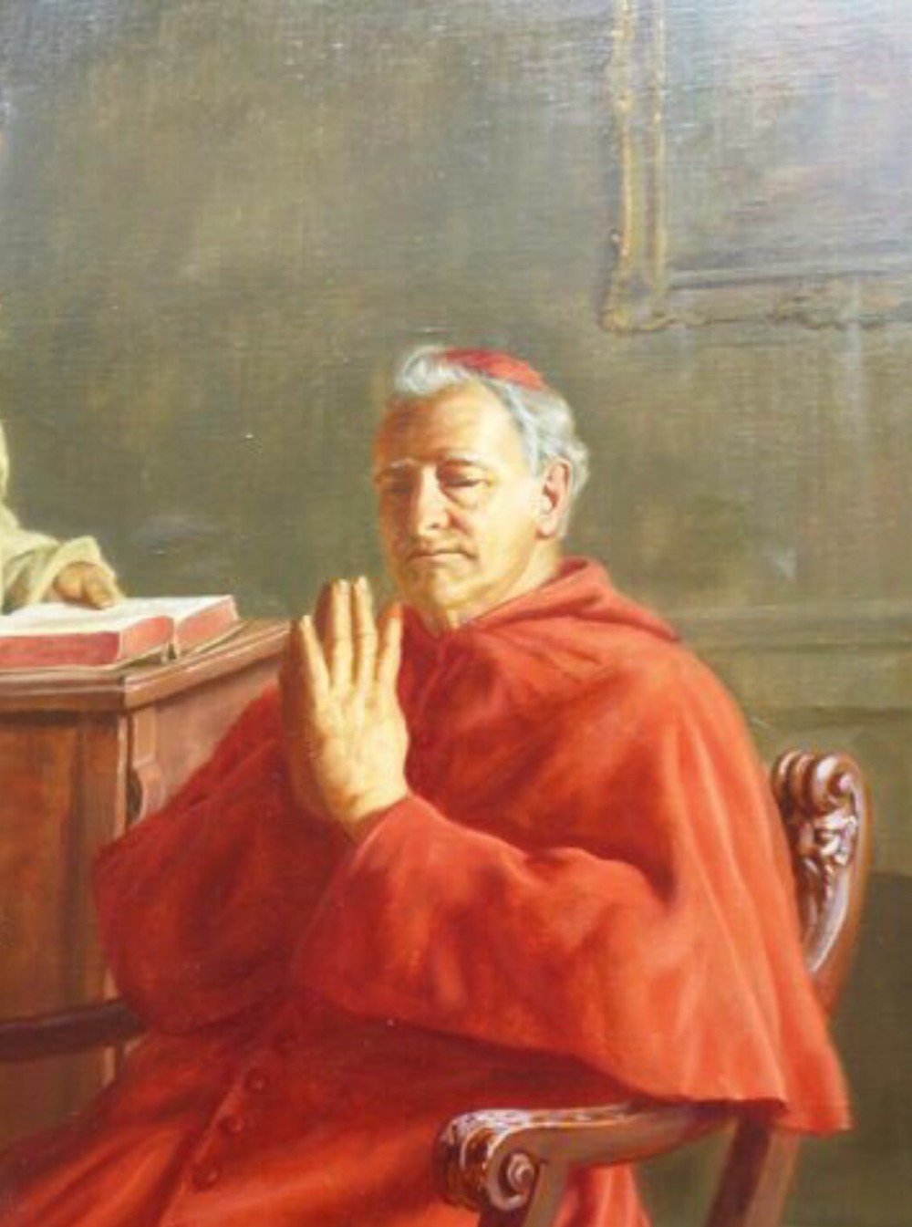 A 19th-century framed oil painting depicting a Vatican cardinal in red robes sitting in prayer beside a monk at a book-laden table. View VII