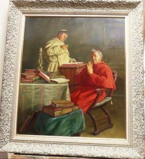 A 19th-century framed oil painting depicting a Vatican cardinal in red robes sitting in prayer beside a monk at a book-laden table.