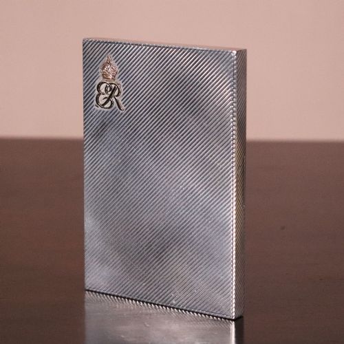 fig 1. An engine-turned silver and gold mounted Cartier notelet case presented inside an open red leather fitted box alongside written correspondence.