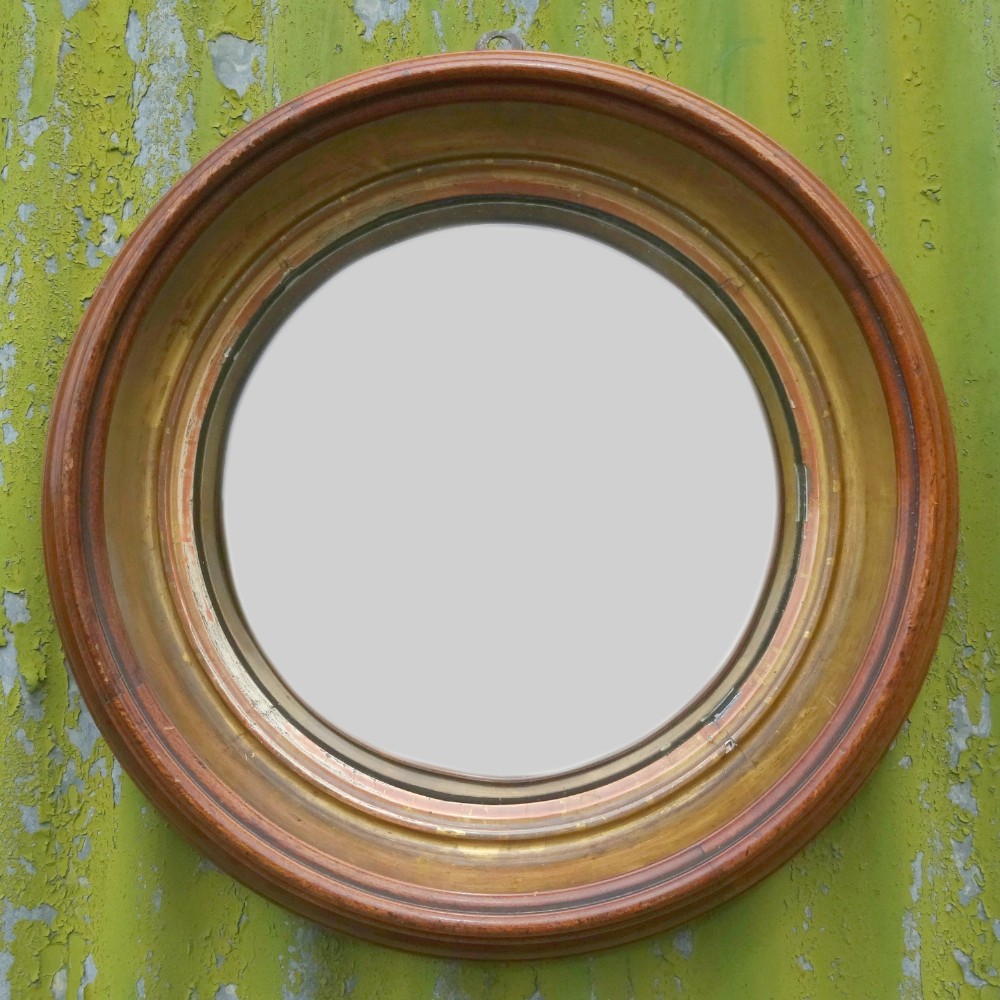 Walnut & parcel gilt convex mirror 
