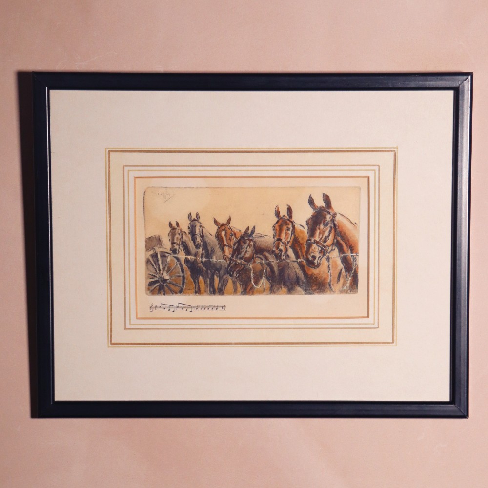 A framed equestrian print depicting a team of artillery horses and a spoked gun wheel, framed with a double wash line mount and a black wooden frame.