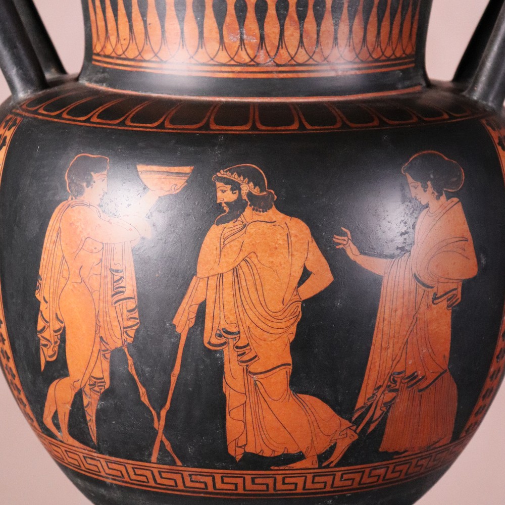 A Neoclassical terracotta column krater vase painted with black slip depicting figures from Greek mythology within geometric borders. View V