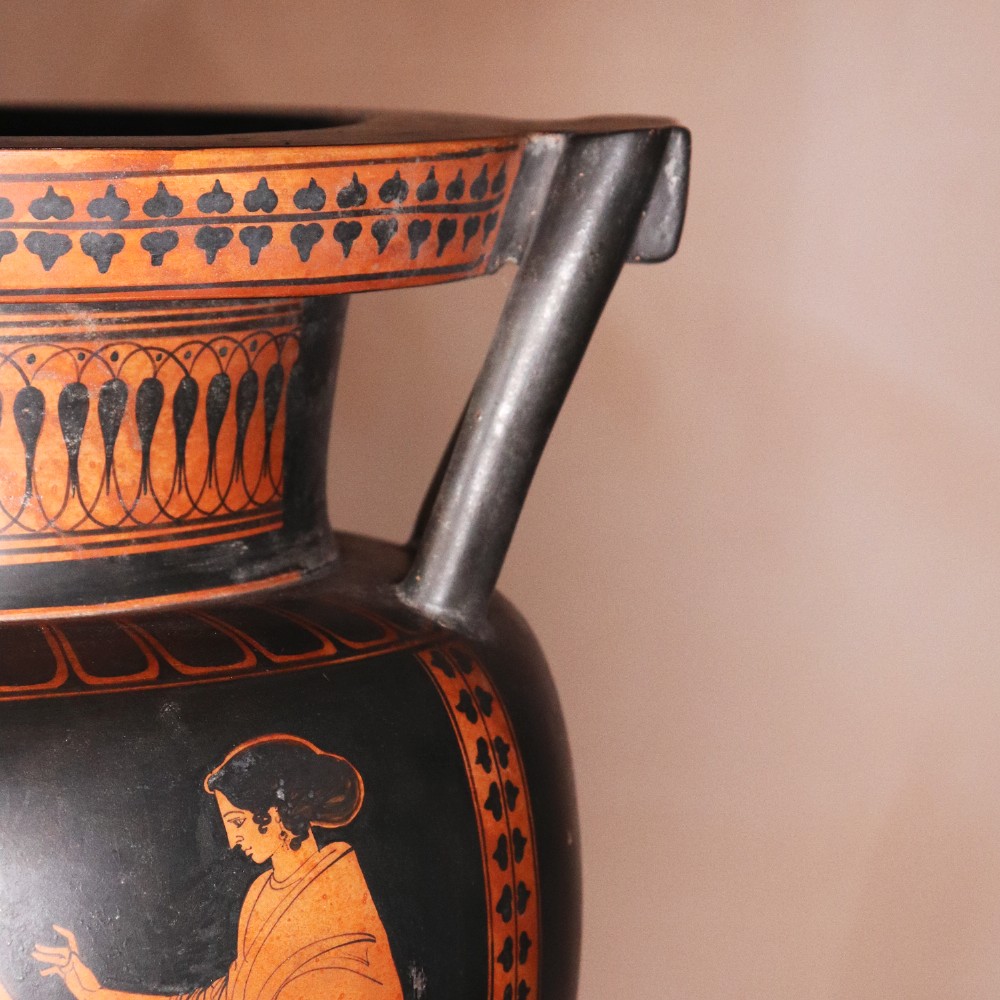 A Neoclassical terracotta column krater vase painted with black slip depicting figures from Greek mythology within geometric borders. View VII