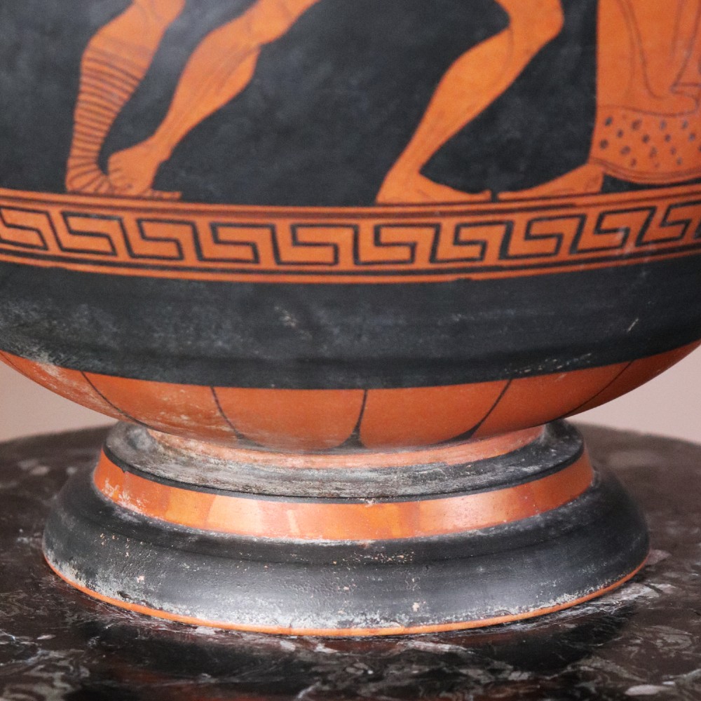 A Neoclassical terracotta column krater vase painted with black slip depicting figures from Greek mythology within geometric borders. View VIII