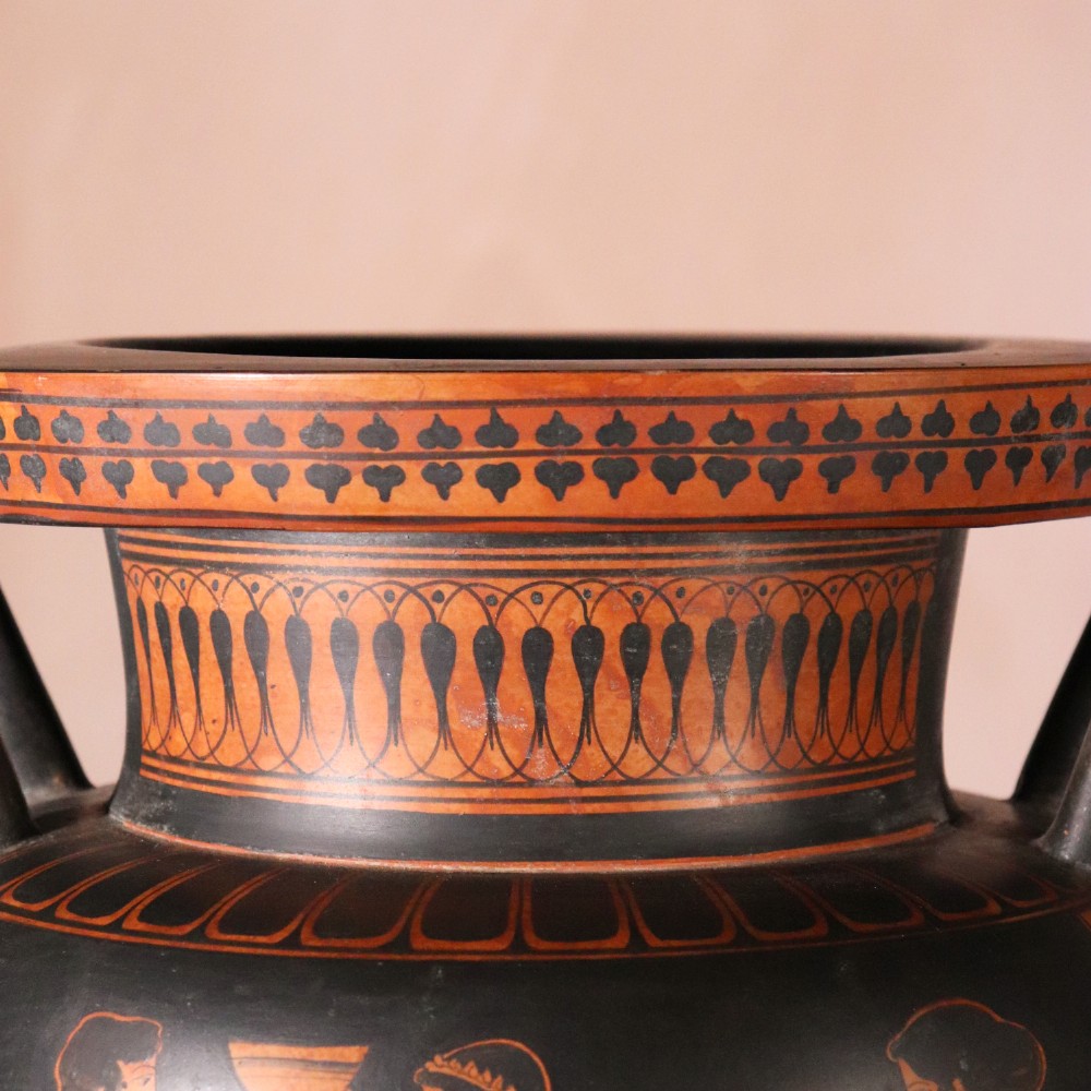 A Neoclassical terracotta column krater vase painted with black slip depicting figures from Greek mythology within geometric borders. View IX