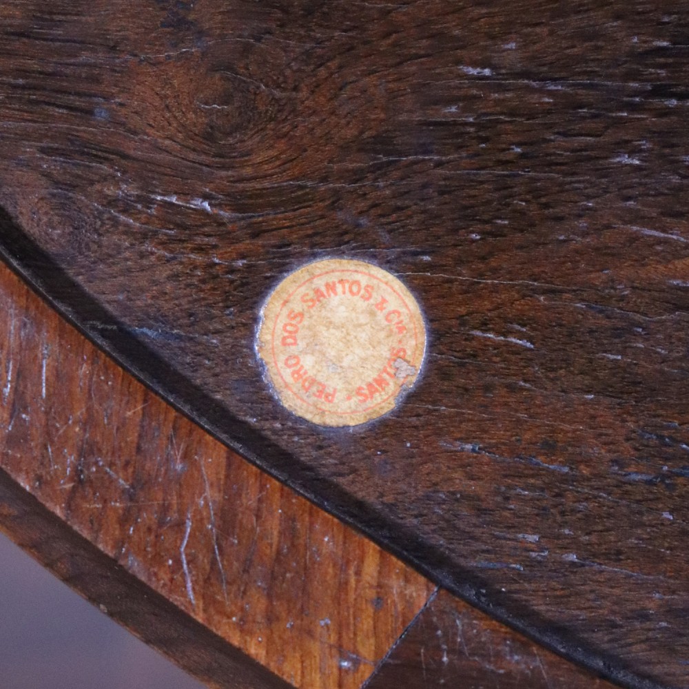 An oval antique tray featuring a central sunburst parquetry design of contrasting specimen woods with carved side handles. View VIII