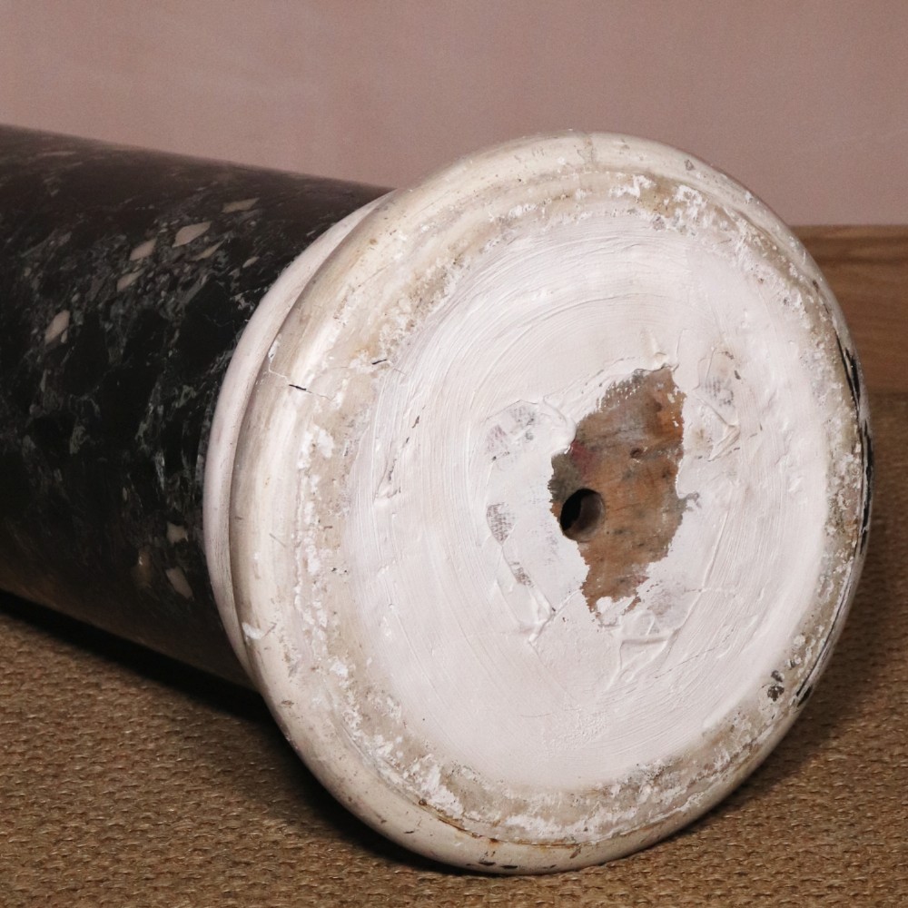 An early nineteenth-century cylindrical scagliola column pedestal with a dark green speckled faux-marble finish resting on a moulded off-white circular base. View VII