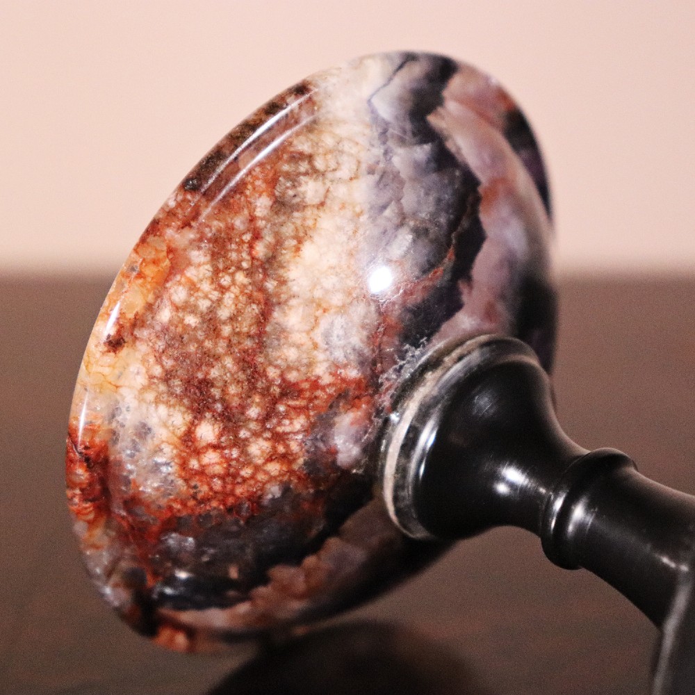 A small nineteenth-century tazza featuring a shallow turned Blue John bowl with purple and brown banding, set upon a black turned marble stem and square base. View IV