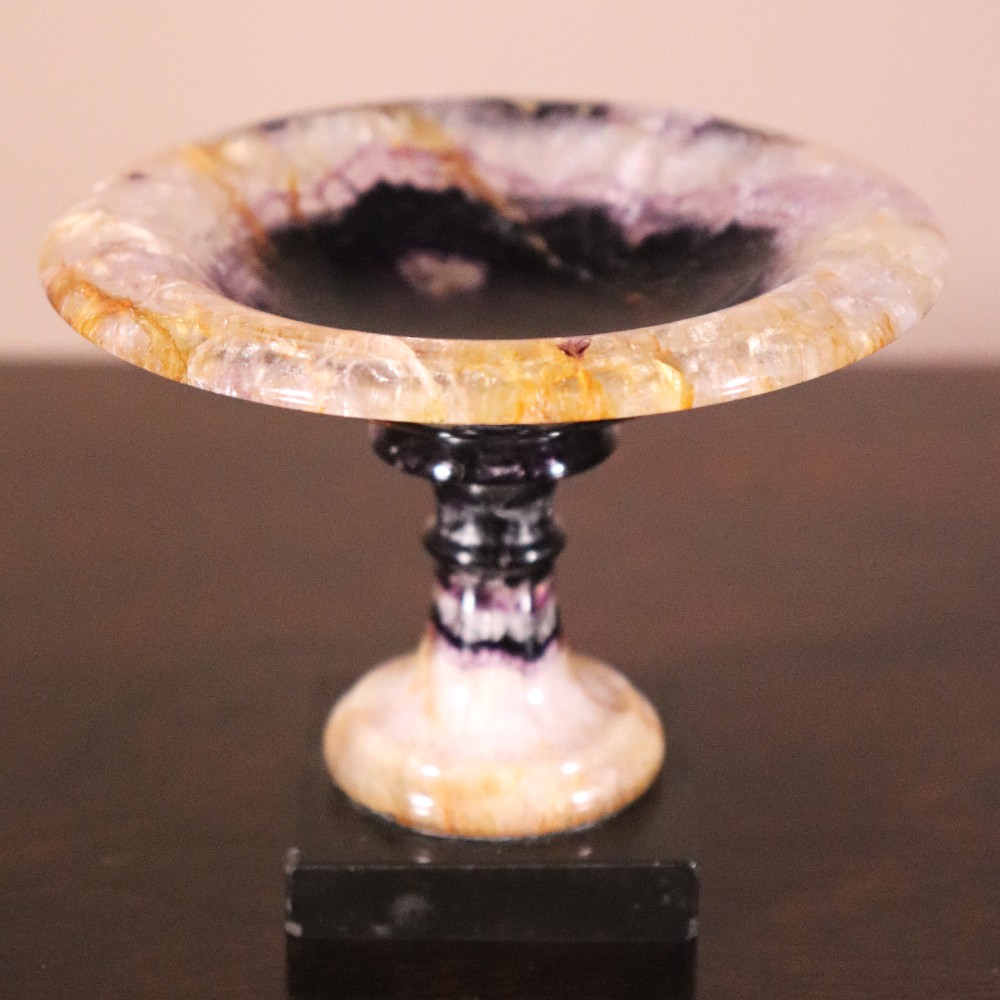 A small 19th-century Blue John fluorite tazza with purple and yellow banding, mounted on a turned stem and a square black marble base. View III