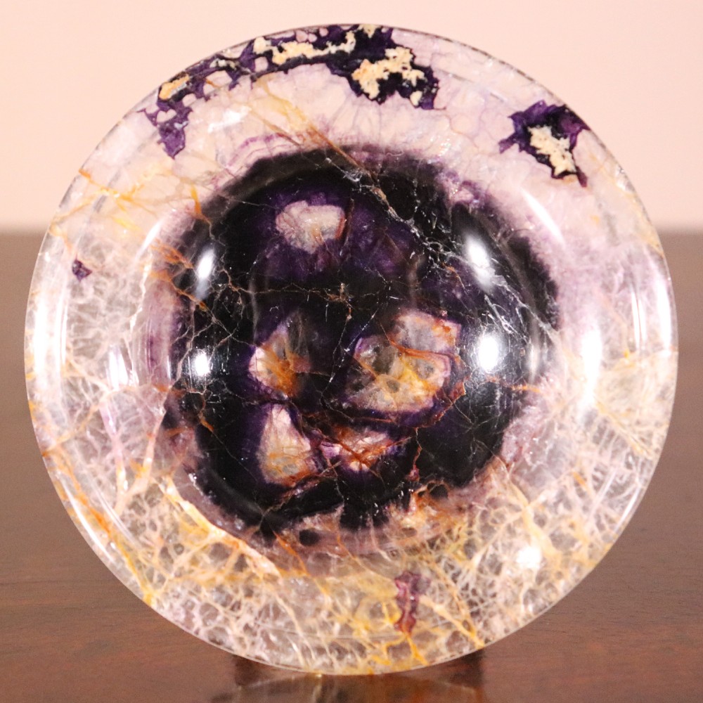 A small 19th-century Blue John fluorite tazza with purple and yellow banding, mounted on a turned stem and a square black marble base. View V