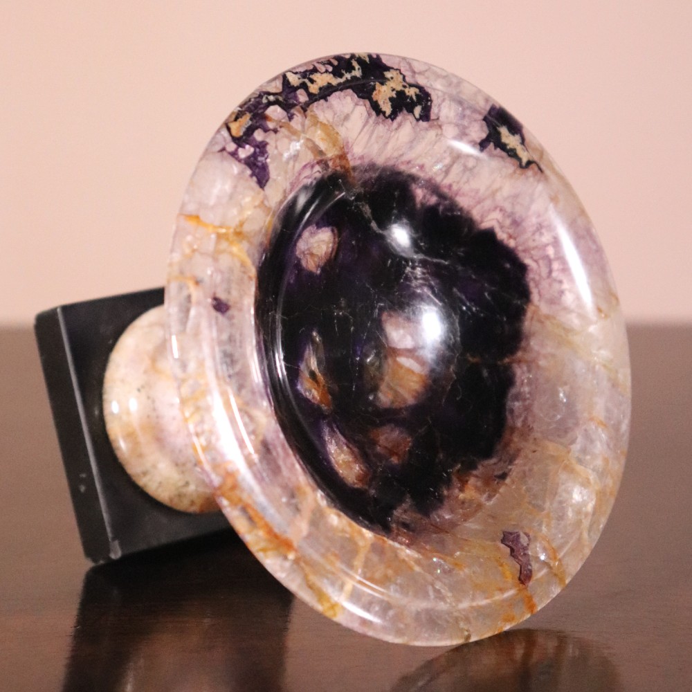 A small 19th-century Blue John fluorite tazza with purple and yellow banding, mounted on a turned stem and a square black marble base. View VII