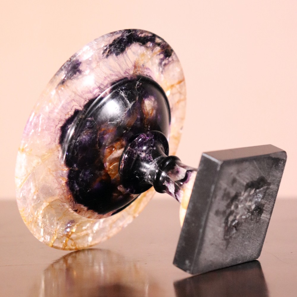 A small 19th-century Blue John fluorite tazza with purple and yellow banding, mounted on a turned stem and a square black marble base. View VIII