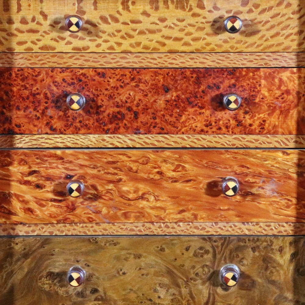A 19th-century wooden table cabinet with two doors featuring inlaid star motifs set within pointed arches, resting on turned bun feet. View VI
