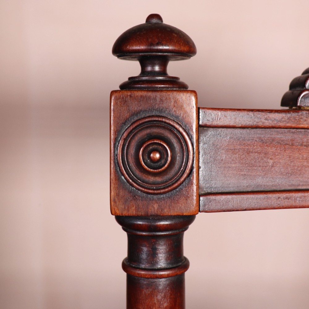 A set of six Regency period side chairs crafted from dark Goncalo Alves timber featuring carved crest rails, detailed backsplats, turned front legs, and hand-woven cane seats. View V