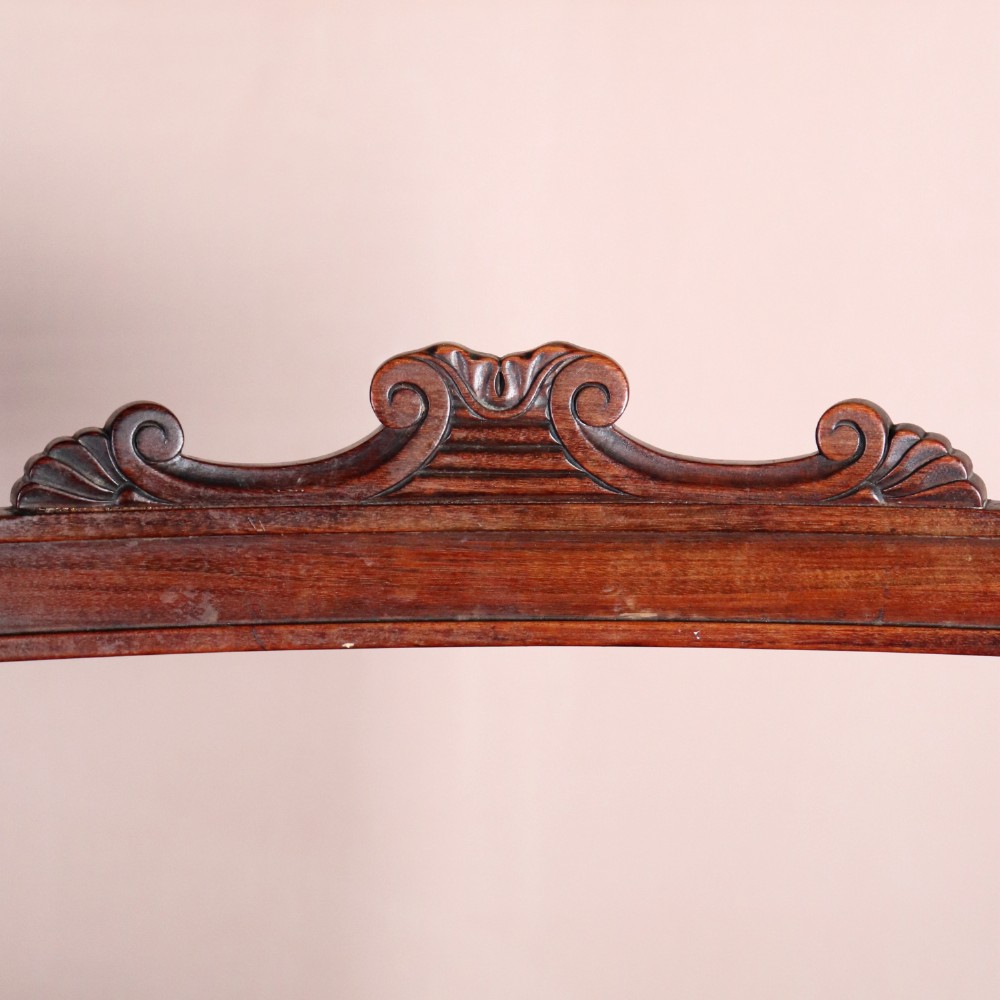 A set of six Regency period side chairs crafted from dark Goncalo Alves timber featuring carved crest rails, detailed backsplats, turned front legs, and hand-woven cane seats. View VI