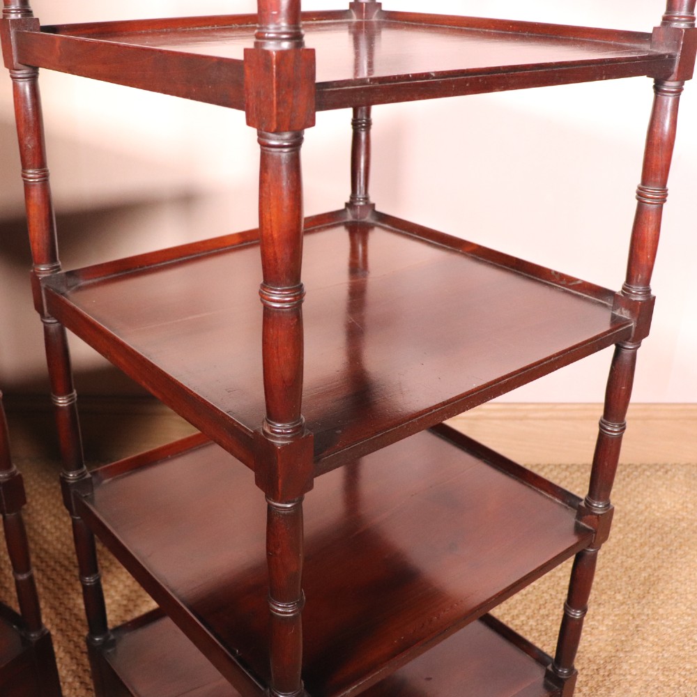 A matching pair of George IV mahogany whatnots featuring five open tiered shelves with turned supports, a single base drawer, and brass castors. View VIII