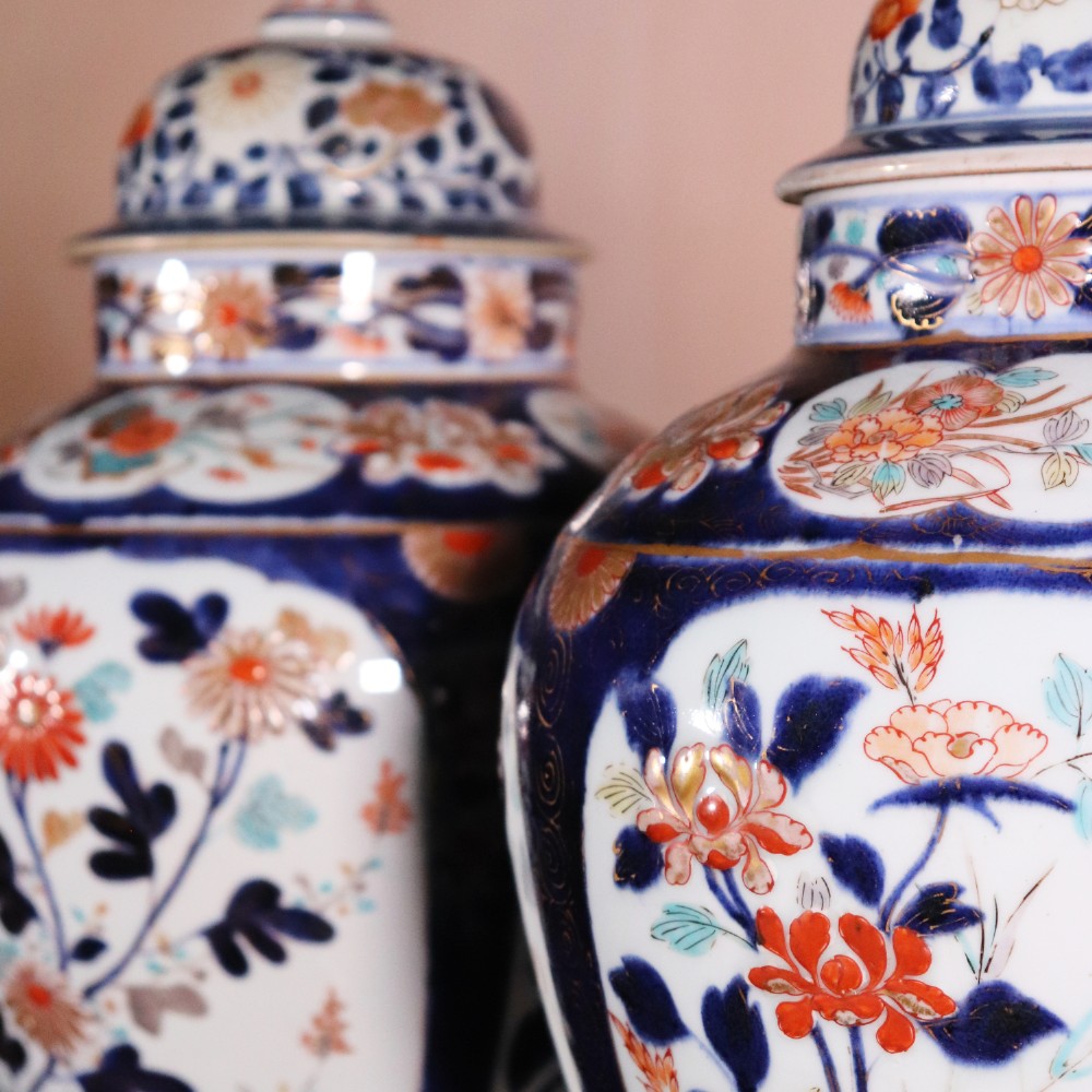 A pair of early eighteenth-century Japanese Arita porcelain lidded jars decorated with cobalt blue, red, and gold floral patterns. View VIII