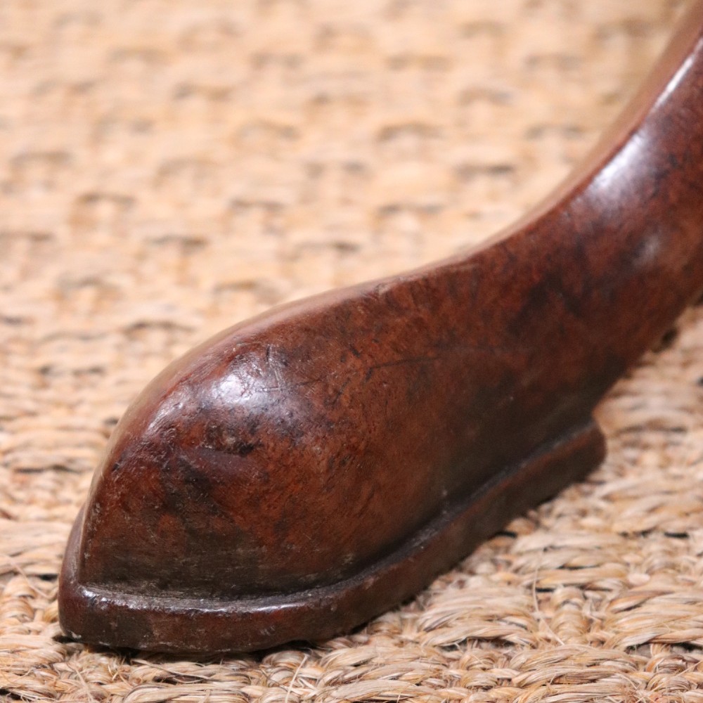 A George II dark mahogany torchere featuring a dished top, turned baluster column, and a tripod base with pad feet. View X