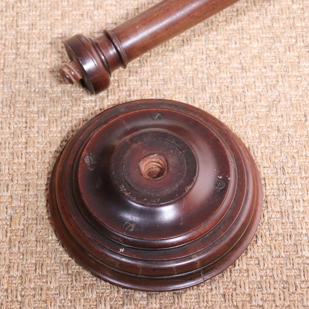 A George II dark mahogany torchere featuring a dished top, turned baluster column, and a tripod base with pad feet. View XI