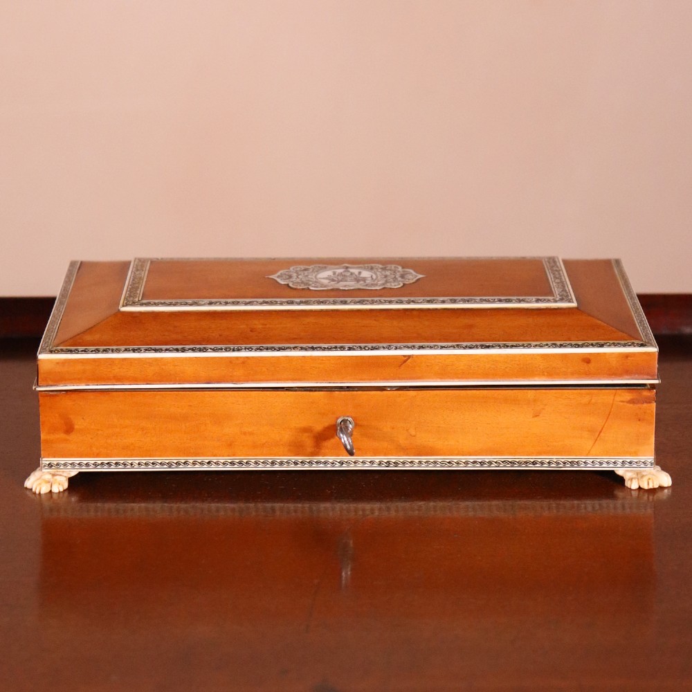 A rectangular sandalwood card box with penwork-engraved ivory borders, carved lion-paw feet, and a central medallion motif. View II
