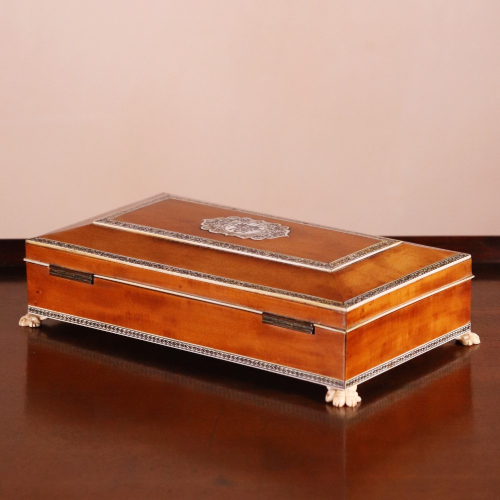 A rectangular sandalwood card box with penwork-engraved ivory borders, carved lion-paw feet, and a central medallion motif. View IV