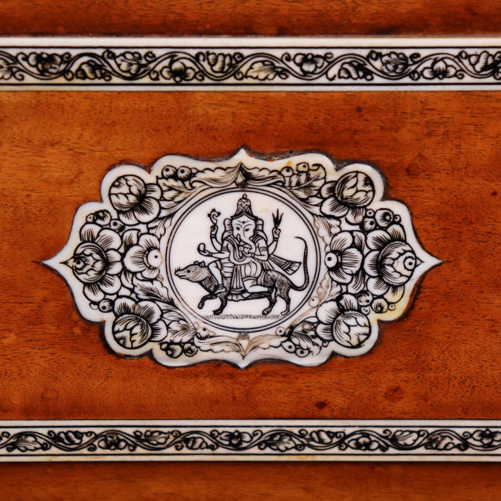 A rectangular sandalwood card box with penwork-engraved ivory borders, carved lion-paw feet, and a central medallion motif. View VI