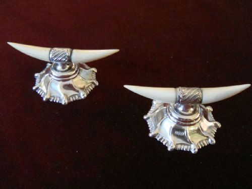 A Pair of Silver Ivory Knife Rests