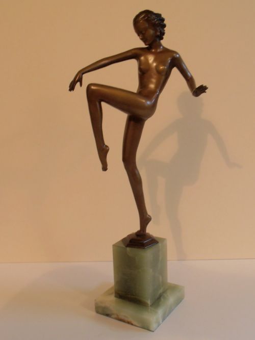 A Large Art Deco Patinated Bronze Figure of a Naked Dancing Girl