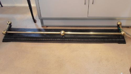 A Victorian Cast Iron and Brass Fender