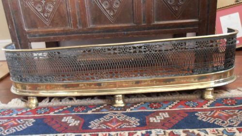 A Georgian Brass Fender on Three Pad Feet