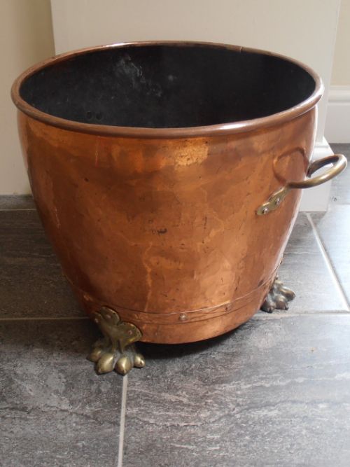 A Copper and Brass Cauldron Shaped Bucket