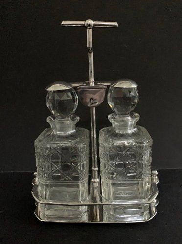 An Unusual Silver Plated Two Bottle Tantalus