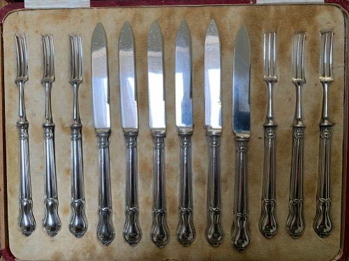 A Set of Silver Handled Fruit Knives and Forks
