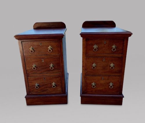 A Pair of Three Drawer Mahogany Bedside Tables