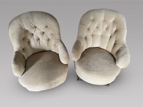A Pair of Low Button Back Chairs